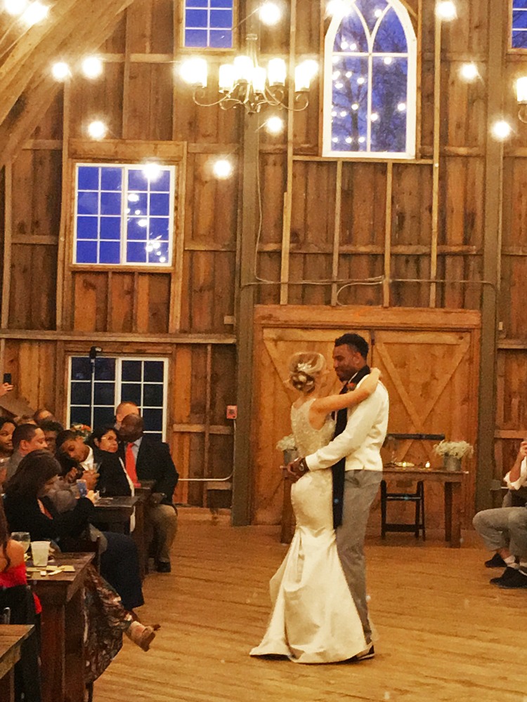 Historic Barn MN - Mixed race couple enjoying their first dance as husband and wife - Agnes Verano weddings capturing the moment